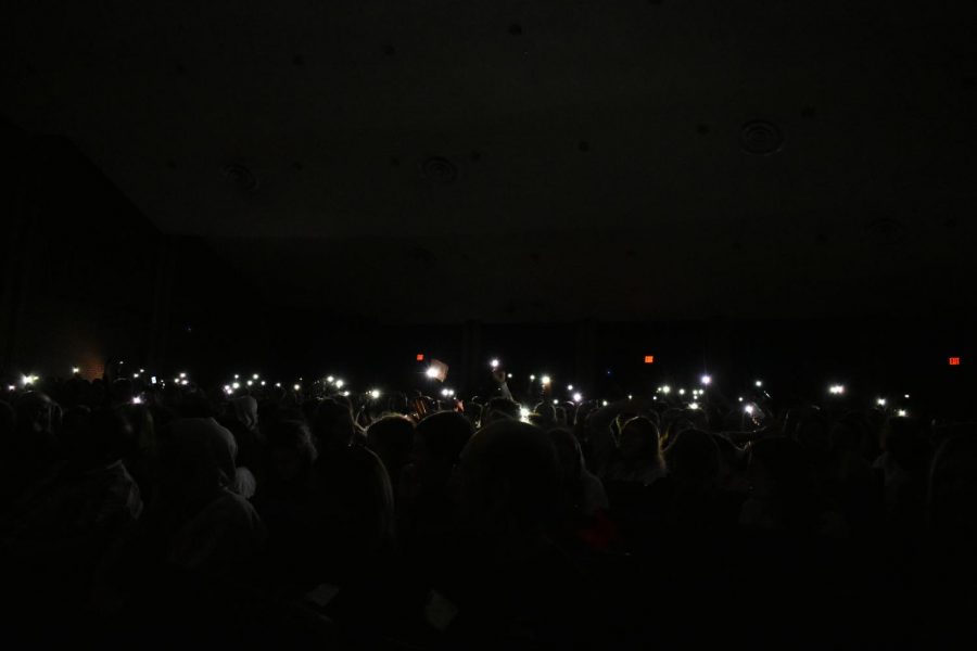 The audience pulled up their cameras flashlights during Kaitlyn Aguilars performance. 
