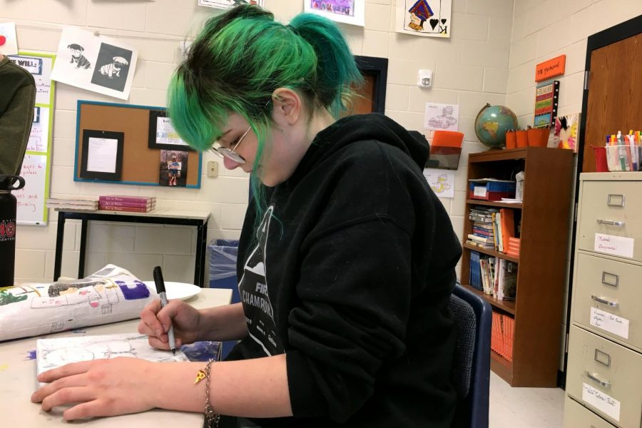 Art student Grace Larsen works on her VASE project