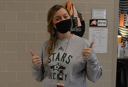 At the Daniel Ninth Grade Campus, English teacher Kendall Sifuentes wears a Dallas Stars sweatshirt Sept. 15 following the Stars victory in the Western Conference Finals.