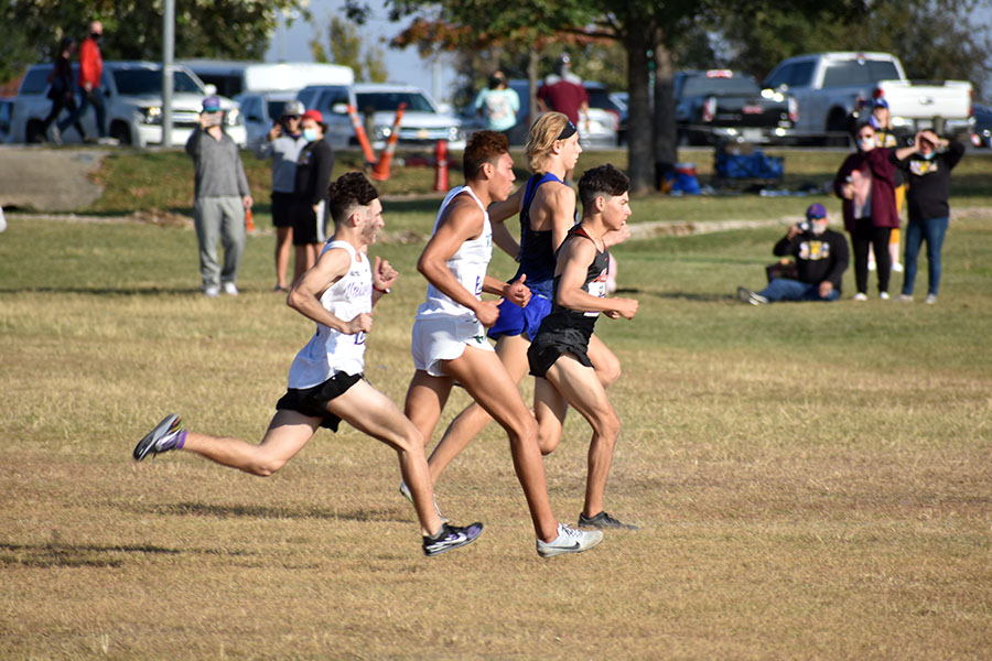 Junior Isaac Hernandez pushes to the lead pack at the start of the state cross country race in Old Settlers Park.