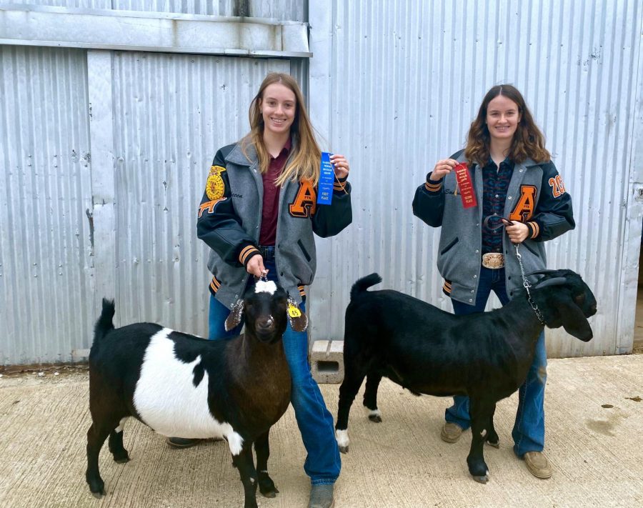 Rebecca Sullivan (left) poses with her prize-winning goat.