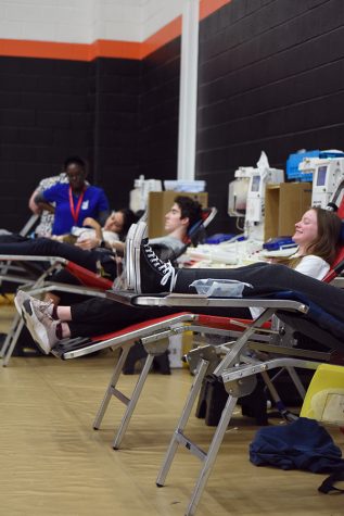 Students sit and relax as they get their blood drawn at the yearly blood drive held the high school. Feb. 28.