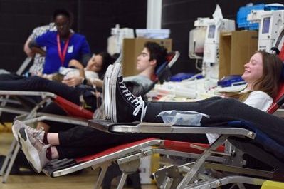Students sit and relax as they get their blood drawn at the yearly blood drive held the high school. Feb. 28.