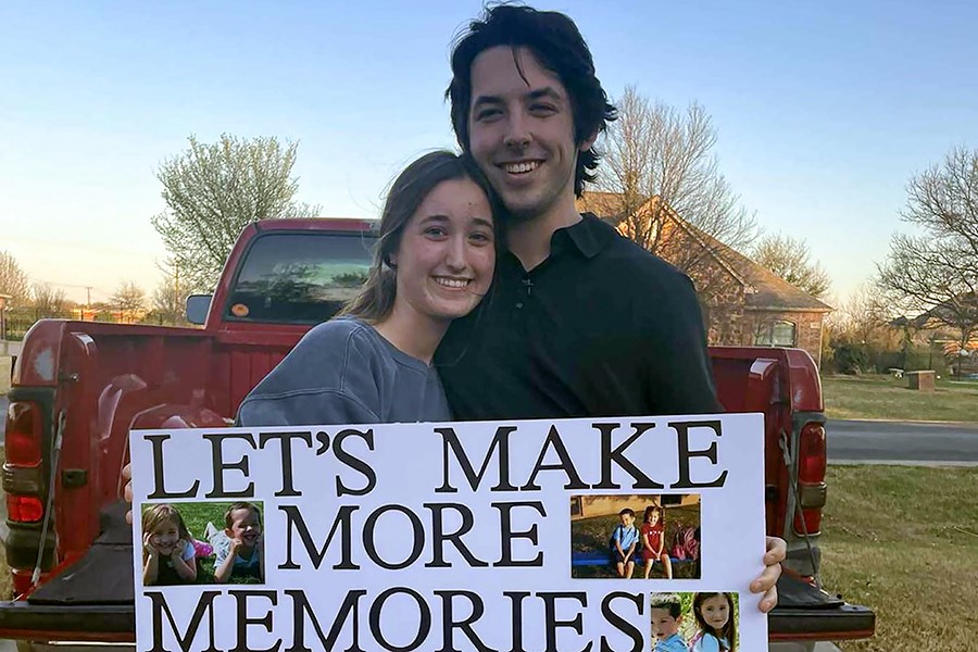 Seniors Aly Saunders and Jackson Cockerham pose after Cockerham promposed using photos of the two from kindergarten on April 1.