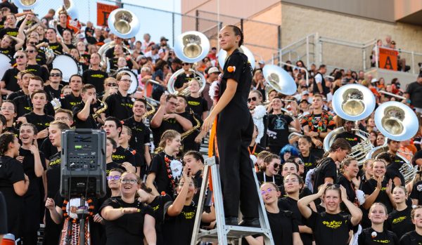 At the homecoming game, drum major senior Isabella Stamper watches the varsity football team play against Birdville High School Friday, Sept. 20.