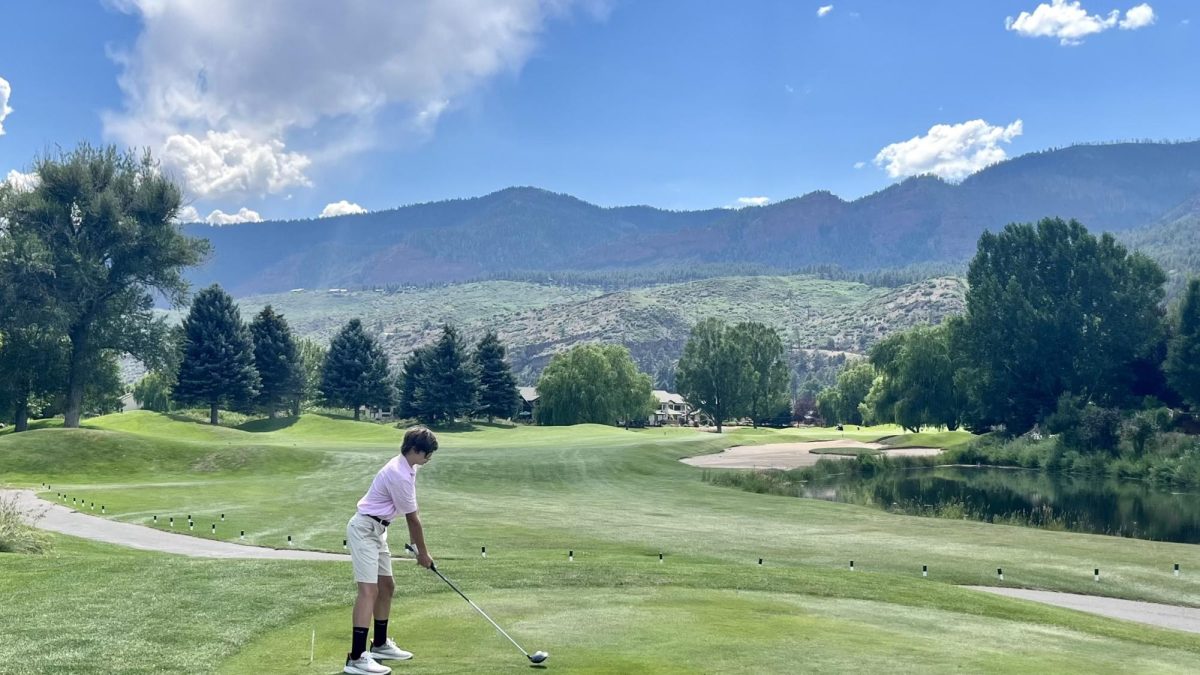 Swinging to sights.  JV athlete Christian Moll prepares to swing on the Dalton Ranch golf course at Colorado.  Moll went there on vacation in August, but continued to work on his golf skills there.  "Golf is different because it is longer than most sports and involves all parts of body," Moll said.
Photo Contributed by: Christian Moll