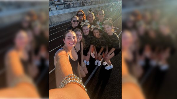 Student council members Allison Faulkner, Hayley Hill, Marley Parker, Eleanor Jack and Kate Forman meet with the Birdville High School Hawks student council to participate in a gift exchange Friday, Sept. 20.