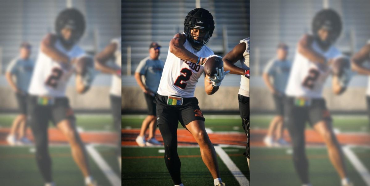 As he practices during pre-season, Kayden Finley runs through receiver warm ups Tuesday, Aug. 13