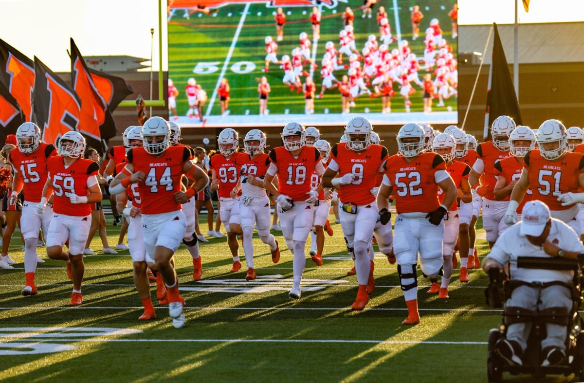 PREPPING FOR TAKE DOWN
The varsity football team storms the field at the homecoming game against Birdville High School Friday, Sept. 20