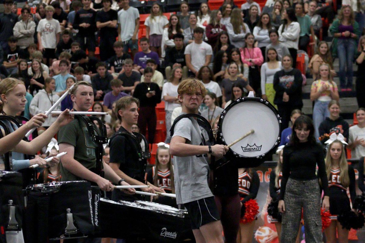 MAKE SOME NOISE As the Box Boys battle the drum line, freshman Logan Steele hypes the crowd at the last pep rally of the year Friday, Nov. 8.