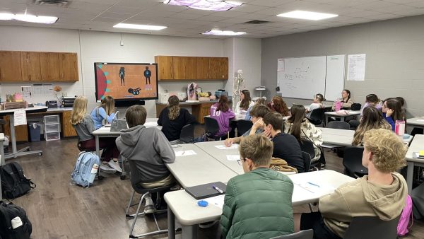 REPRODUCTIVE REVIEW As they learn about the reproductive system, CTE department head Jenni Meador shows a video to her medical terminology class Wednesday, Dec. 4, during sixth period. 