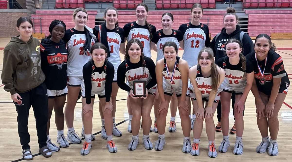 Picture Perfect
Following the tournament at Burleson High, the girl’s basketball team poses for a picture Saturday, Dec. 7.