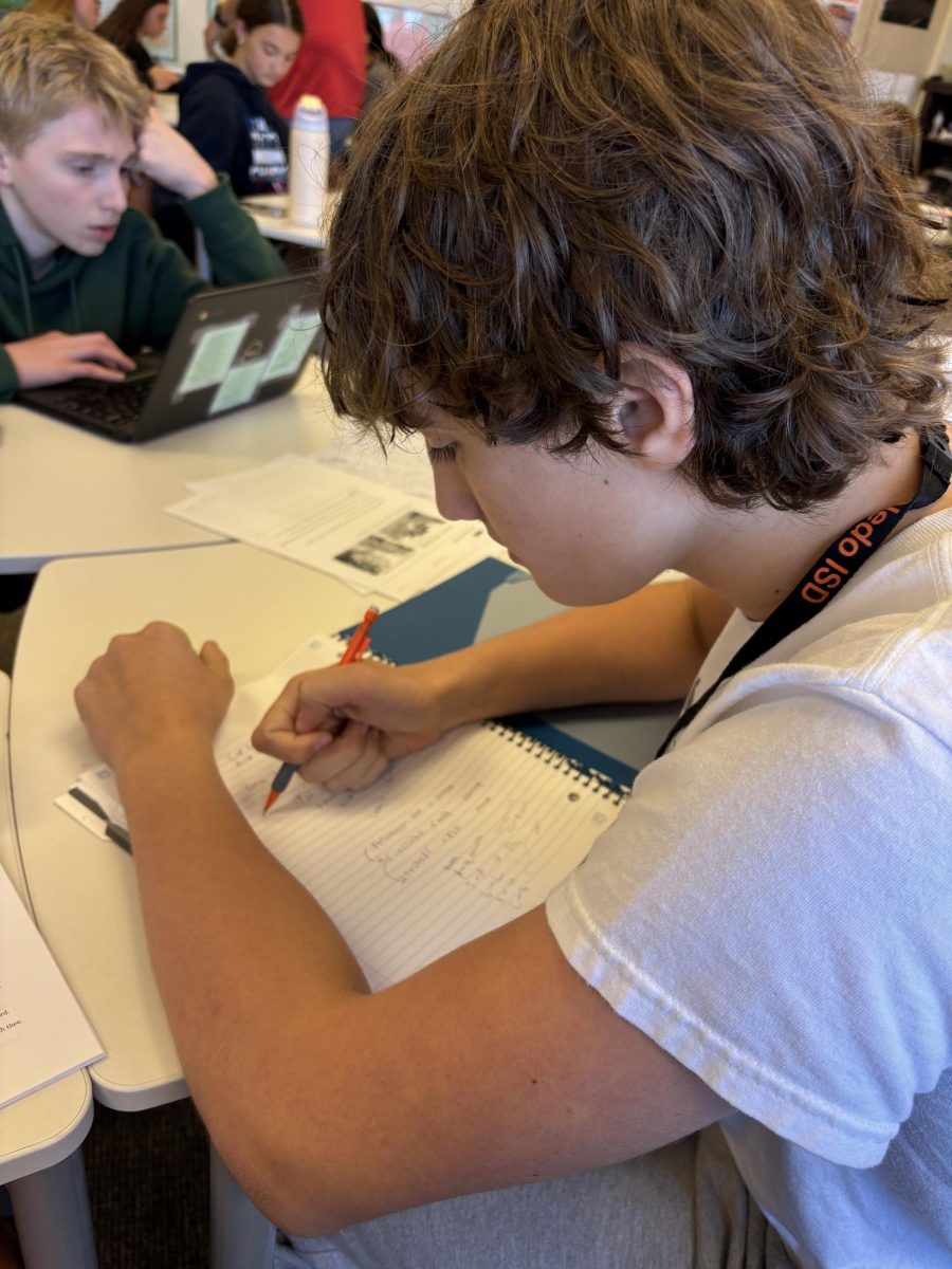 Language Learner.  Freshman Benjamin Hungerford works on some Spanish homework during flex time.  Hungerford has been doing Spanish for 2 years, starting in 8th grade.  "The school could implement more languages right away instead of slowly moving from TxVSN to in-person." Hungerford said.