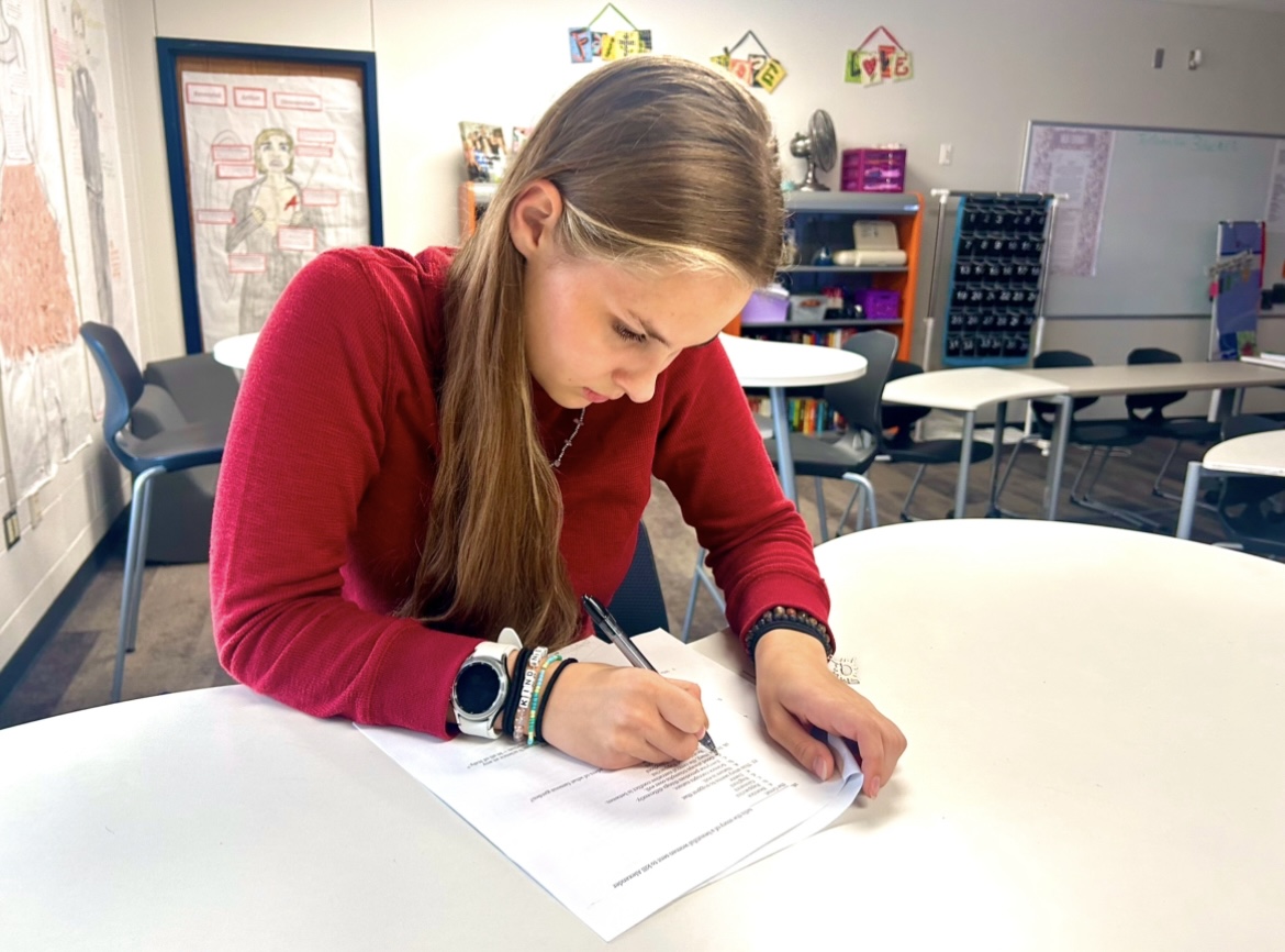 As she prepares for the upcoming competition season, Amber Furlow takes a literary criticism exam Friday, Dec. 6.