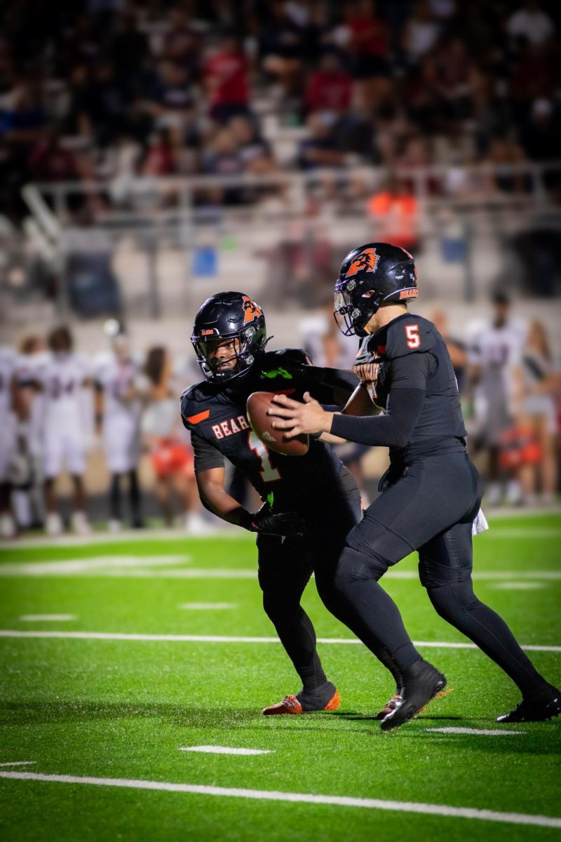 Raycine Guillory (Left) and Gavin Beard (right) on a running drive against the Denton Ryan Raiders.