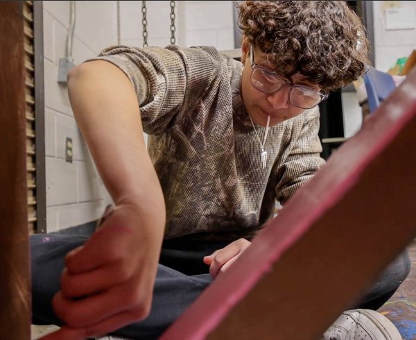 Paying attention to the details, freshman AJ Blakley paints a second coat on a pair of benches for Aledo Player's fall musical "Grease", set to debut Jan. 17-19. Blakley has been working on painting to show as his technical skill for his One Act Play audition. "I am planning to make a slideshow, not my proudest work," Blakley said. "But its on how I'll learn to improve my skills for One Act, mainly painting."