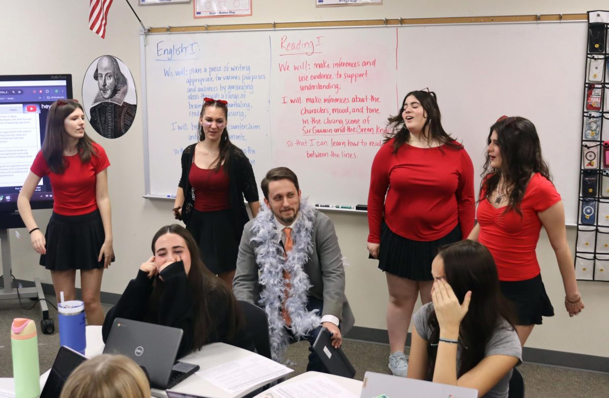 'FALLING FOR YOU'
To raise funds for their organization, four Aledo Player student members serenade English teacher Thomas Mistler, with "Falling For You" from Teen Beach Movie Thursday, Feb. 13, for the annual singing valentine's fundraiser. Students and teachers could purchase a singing valentine for students for $6 during lunches to benefit the theater department. 