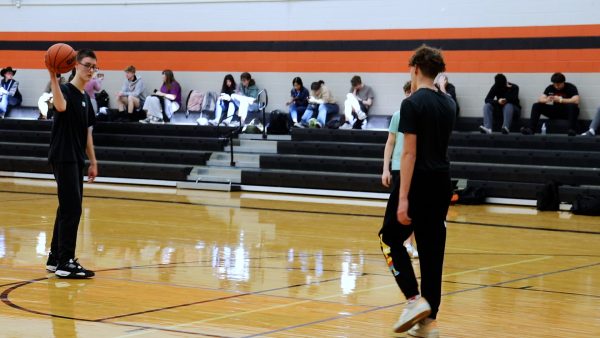 As they play basketball during their outdoor education period, students use this time to relax from stressful days. 